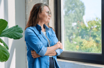 person looking reflective soft light minimal aging gracefully