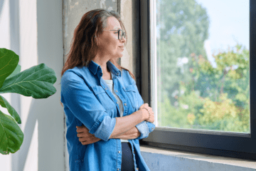 person looking reflective soft light minimal aging gracefully